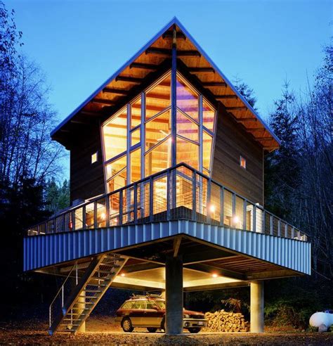 black metal a frame house on stilts|buildings on wooden stilts.